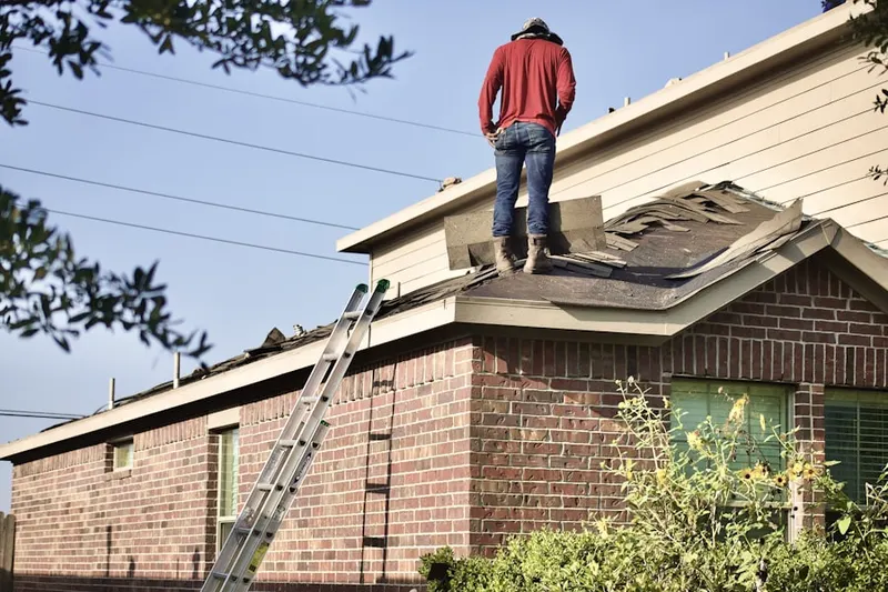 Professional roofer working on a residential roof in West Covina Central Business District